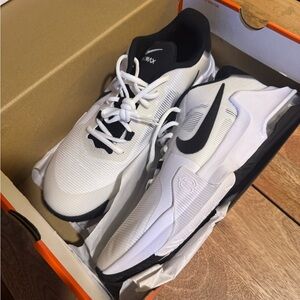 Nike Air Max Impact 4
White and Black Athletic Shoes